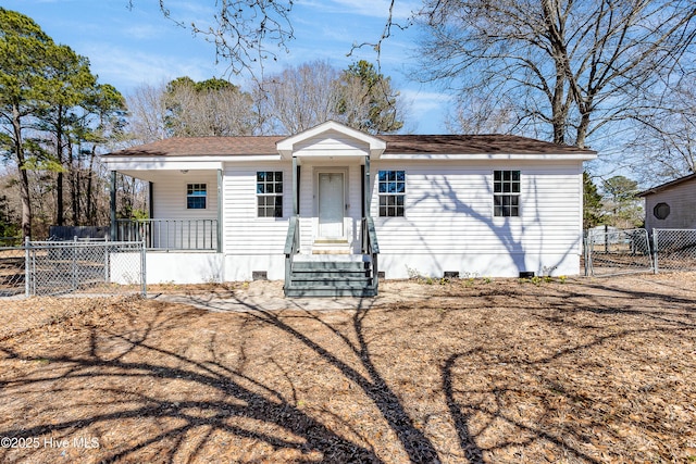 view of front of home featuring crawl space, fence, and a gate