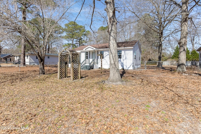 view of front of house featuring fence private yard