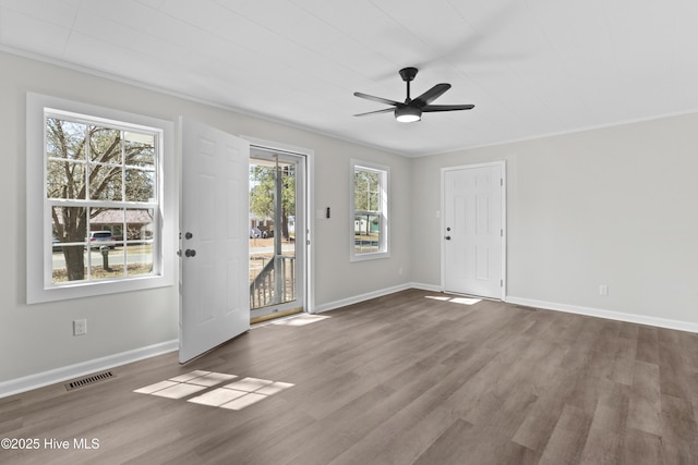 entrance foyer with dark wood-style floors, a ceiling fan, visible vents, and baseboards