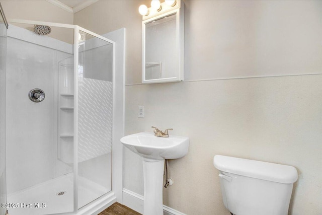 bathroom featuring a shower and toilet