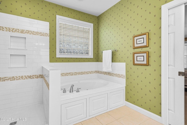 bathroom with tile patterned floors and a bathing tub