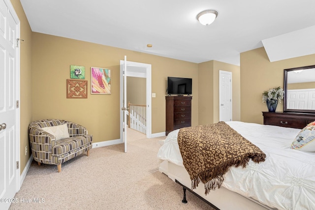 bedroom featuring light carpet