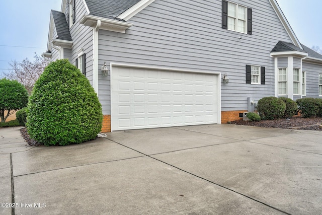 view of side of home with a garage