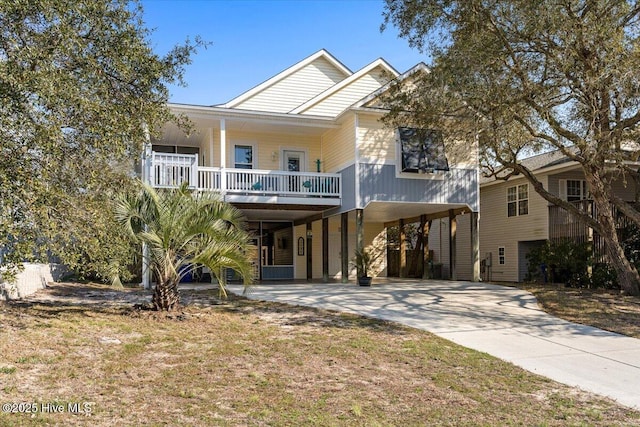 beach home with a carport and concrete driveway