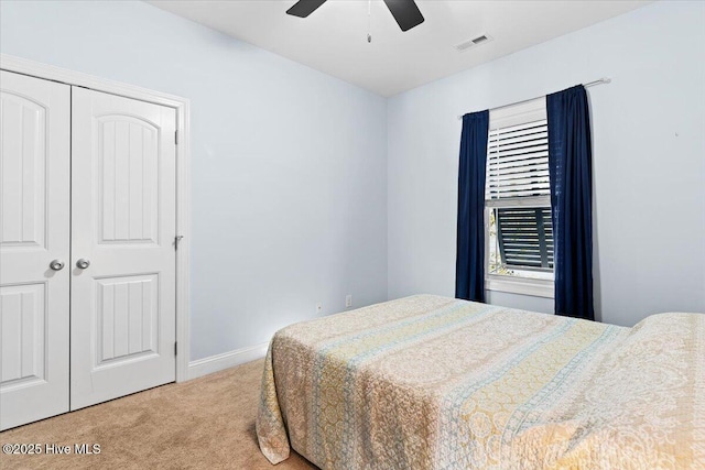 134 NE 11th St, Oak Island, NC 28465 - carpeted bedroom with baseboards, a ceiling fan, and a closet