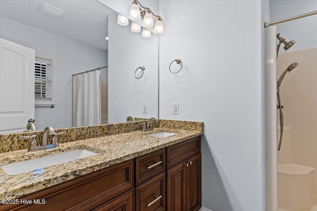 full bathroom with double vanity, a shower with shower curtain, and a sink