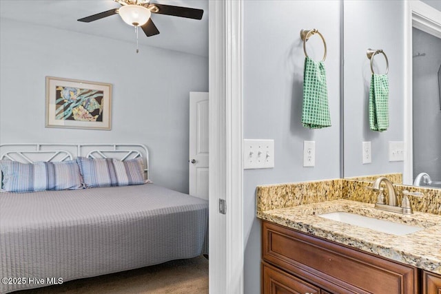 bedroom with a sink, carpet floors, and ceiling fan