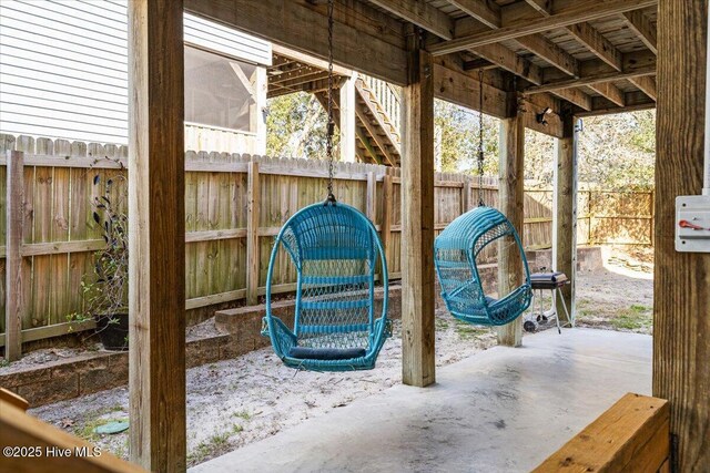 134 NE 11th St, Oak Island, NC 28465 - fenced backyard with a patio
