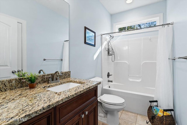 bathroom featuring tile patterned floors, vanity, toilet, and shower / tub combo