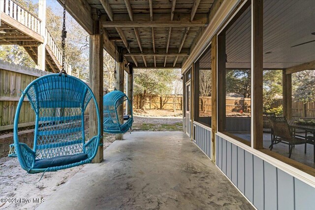 134 NE 11th St, Oak Island, NC 28465 - view of patio / terrace featuring a sunroom and stairs