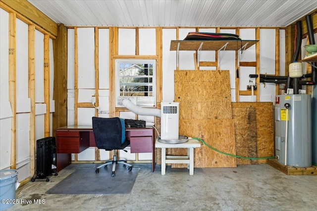 office with unfinished concrete flooring and electric water heater