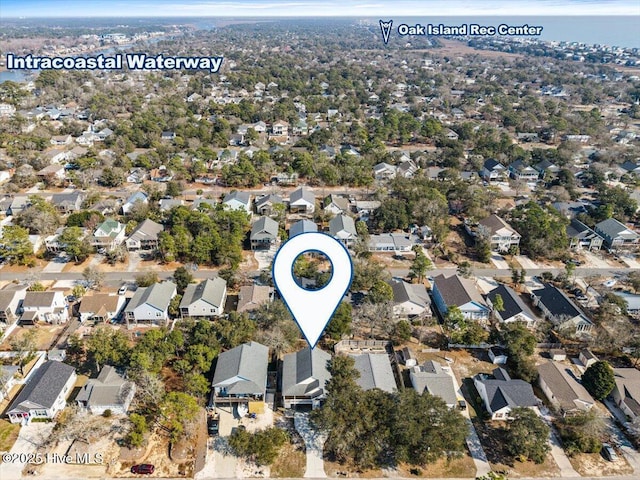 134 NE 11th St, Oak Island, NC 28465 - aerial overview of property's location featuring nearby suburban area and a nearby body of water