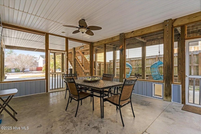 sunroom with a ceiling fan