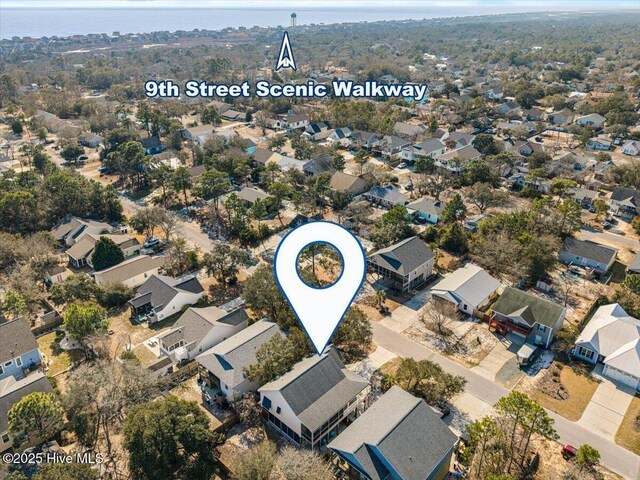 134 NE 11th St, Oak Island, NC 28465 - aerial view of property and surrounding area with nearby suburban area and a nearby body of water
