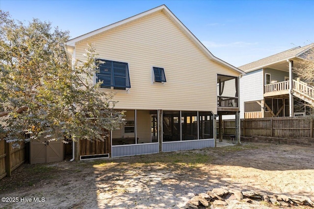 134 NE 11th St, Oak Island, NC 28465 - back of house with a sunroom