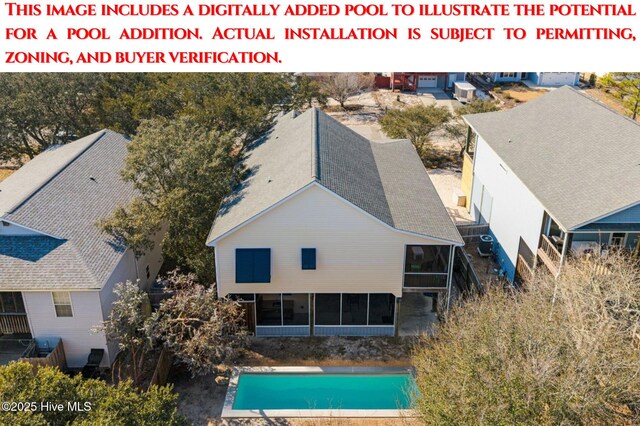 134 NE 11th St, Oak Island, NC 28465 - view of subject property featuring a pool