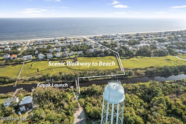 134 NE 11th St, Oak Island, NC 28465 - aerial perspective of suburban area with property parcel outlined and a nearby body of water