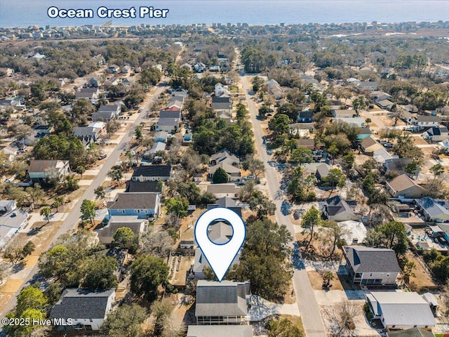 drone / aerial view featuring a residential view and a water view