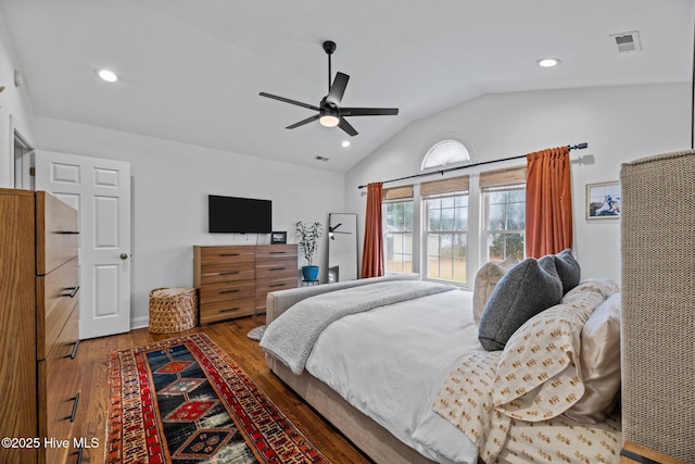 bedroom featuring ceiling fan, lofted ceiling, and hardwood / wood-style floors