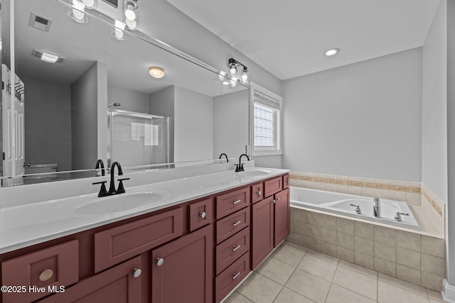 full bathroom with tile patterned flooring, vanity, separate shower and tub, and toilet