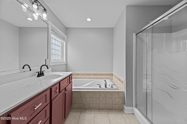 bathroom featuring vanity, tile patterned floors, and plus walk in shower