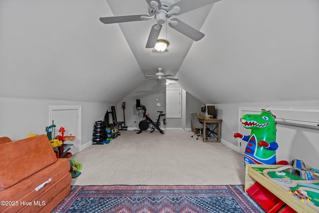 recreation room with ceiling fan, lofted ceiling, and carpet floors