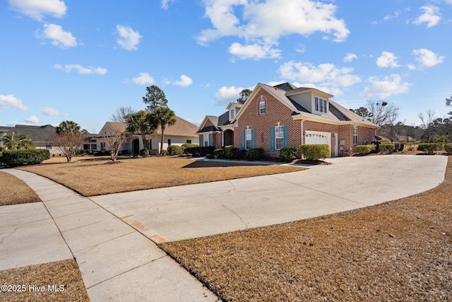 view of front of house featuring a garage and a front yard