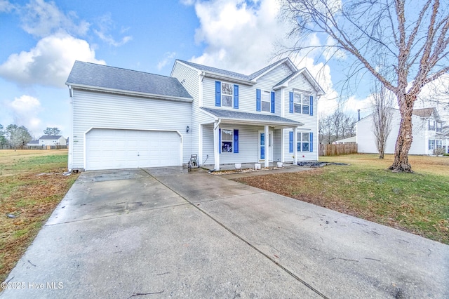 view of property featuring a garage, a porch, and a front lawn