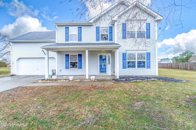 front facade with a garage, a front yard, and covered porch