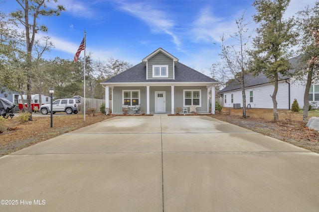 view of front of house featuring covered porch and roof with shingles