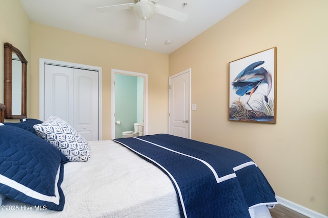 bedroom featuring ceiling fan, ensuite bath, hardwood / wood-style floors, and a closet