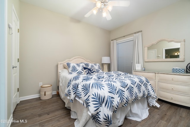 bedroom featuring ceiling fan and dark hardwood / wood-style floors