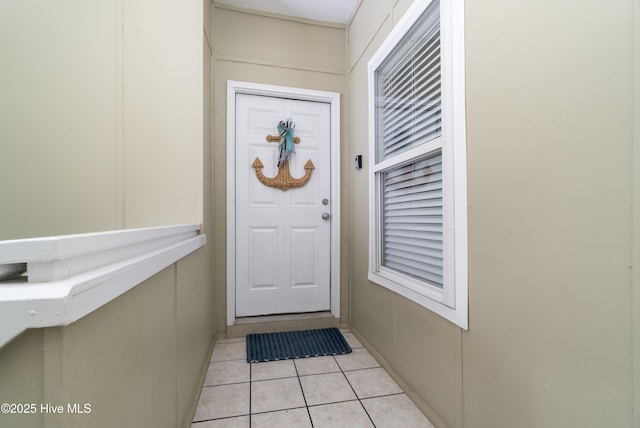 doorway featuring light tile patterned floors