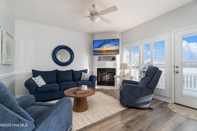 living room featuring hardwood / wood-style flooring and ceiling fan