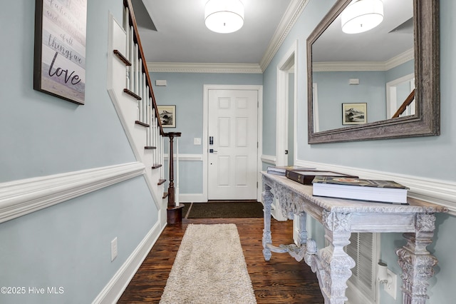 entryway with dark wood-type flooring and ornamental molding