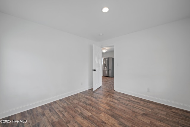 unfurnished room featuring dark hardwood / wood-style flooring