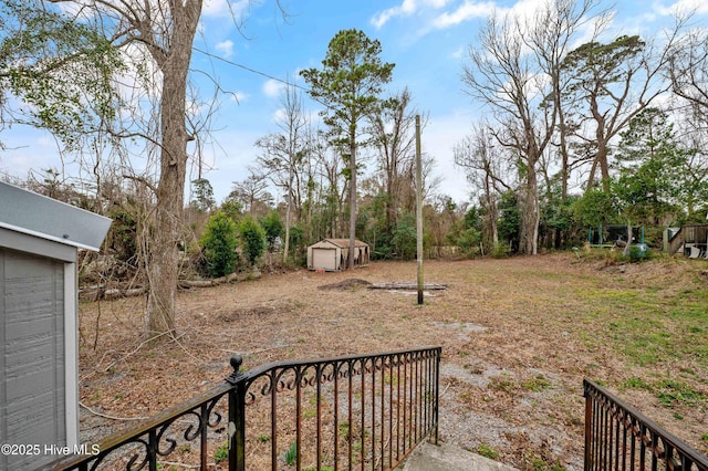 view of yard featuring a storage shed