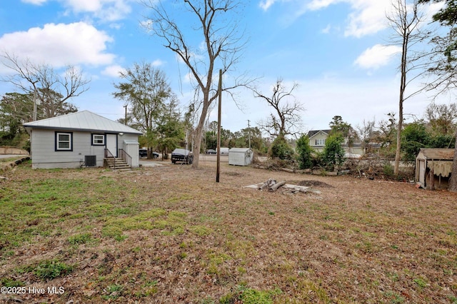 view of yard with central AC