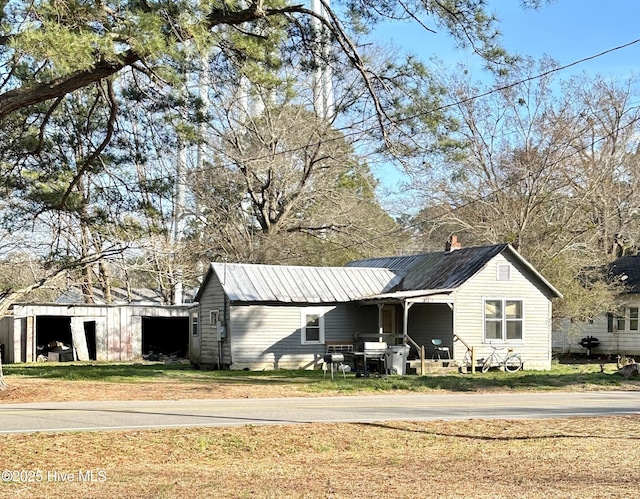 view of outdoor structure featuring a lawn