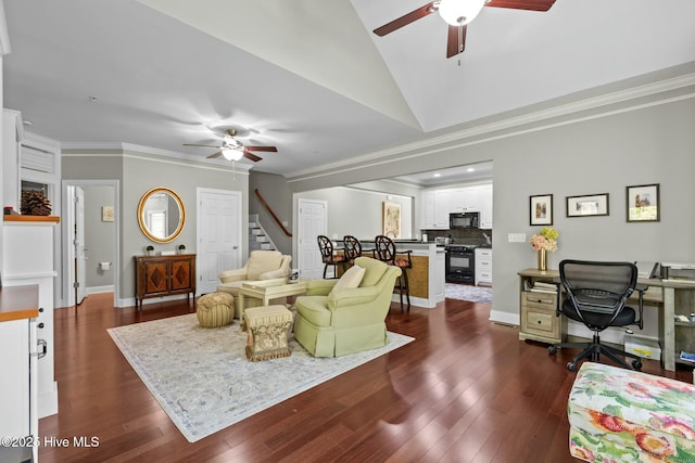 living area with a ceiling fan, crown molding, stairway, and dark wood-type flooring