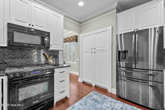 kitchen featuring ornamental molding, white cabinets, decorative backsplash, and black appliances