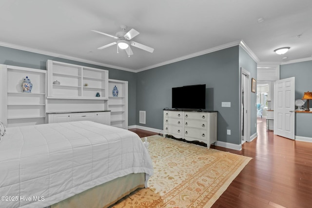 bedroom featuring visible vents, ornamental molding, ceiling fan, wood finished floors, and baseboards