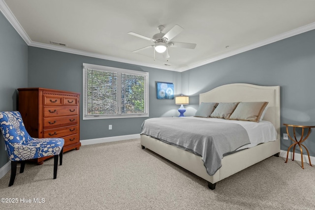 carpeted bedroom with crown molding, ceiling fan, and baseboards