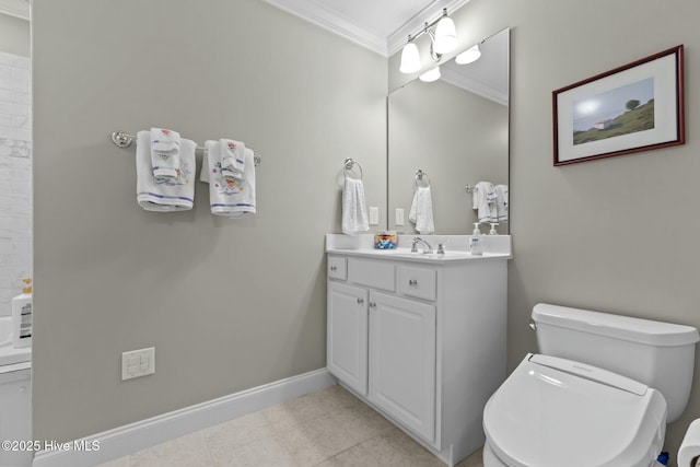 bathroom with toilet, ornamental molding, vanity, and baseboards