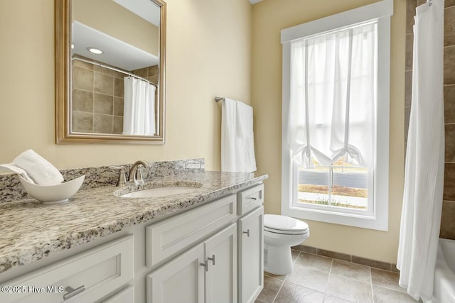 full bathroom featuring vanity, shower / tub combo, tile patterned flooring, and toilet