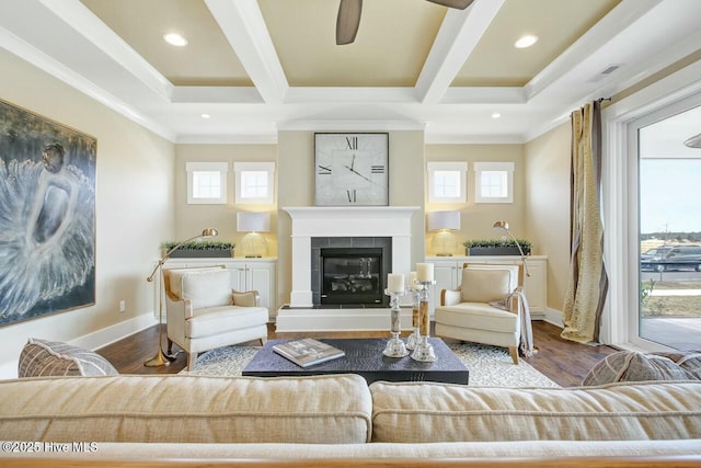 living room featuring hardwood / wood-style flooring, beamed ceiling, and a healthy amount of sunlight