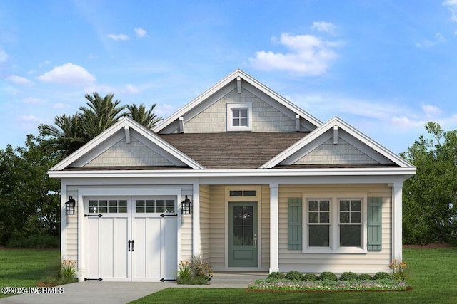 view of front of home featuring a shingled roof, a front yard, and a garage