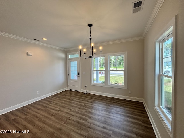 unfurnished dining area with visible vents, baseboards, an inviting chandelier, ornamental molding, and dark wood-type flooring