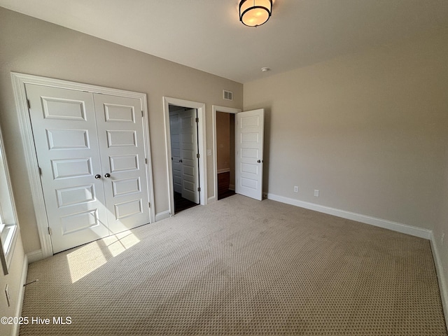 178 Pine View Blvd, Beaufort, NC 28516 - unfurnished bedroom with baseboards, carpet, a closet, and visible vents