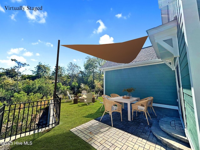 view of patio featuring outdoor dining area